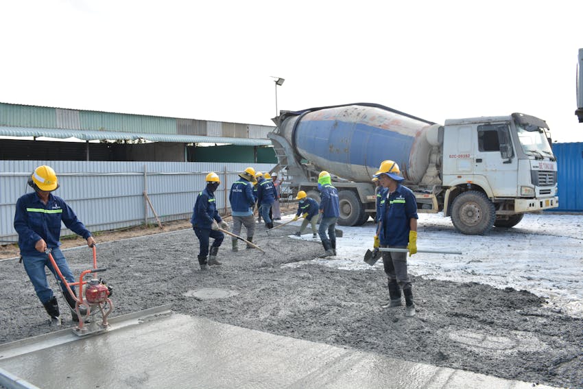 Crew pouring a concrete foundation in the Central Valley
