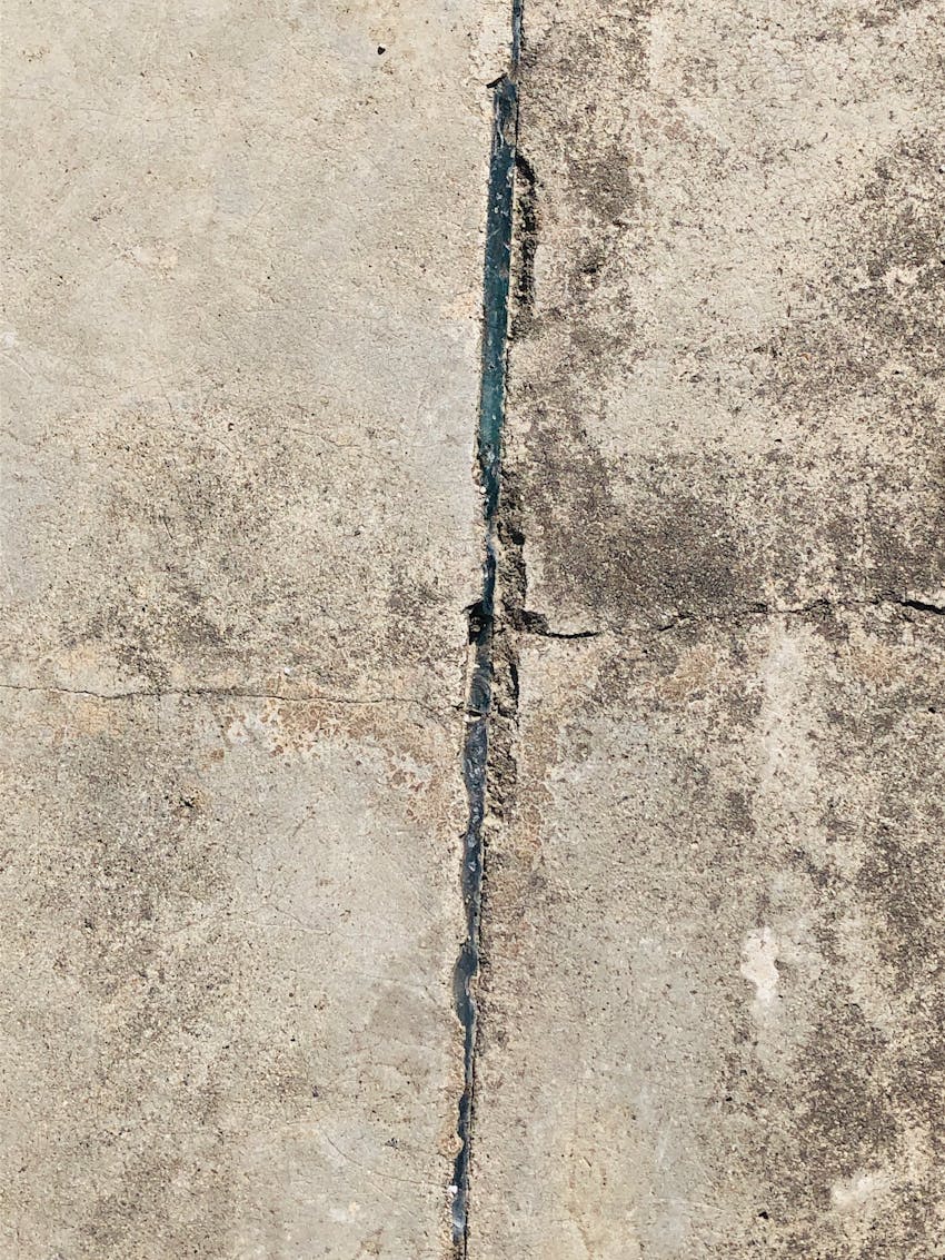Cracked concrete needing repair in Clovis